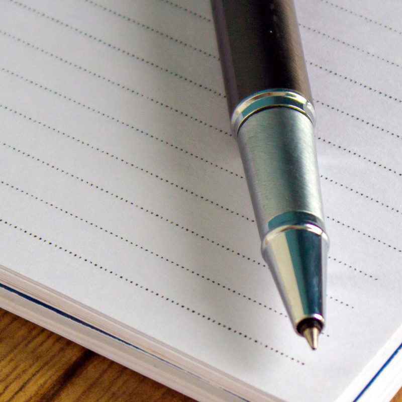 Pen on top of lined paper
